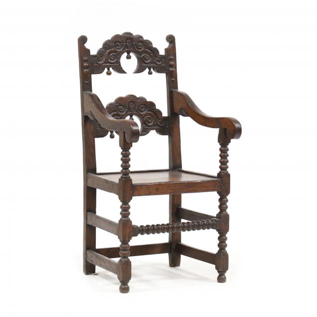 ELIZABETHAN CARVED OAK ARMCHAIR