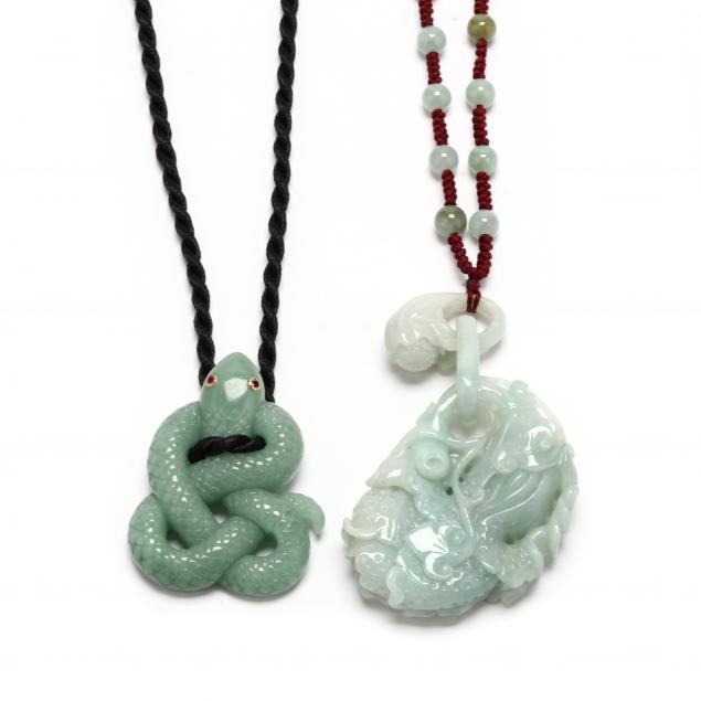 TWO CARVED JADE PENDANTS To include: