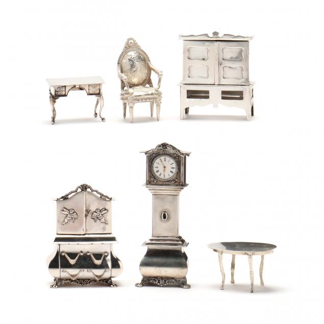 SIX SILVER MINIATURE MODELS OF DOLLHOUSE