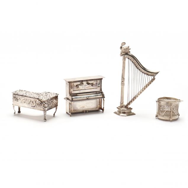 FOUR MINIATURE SILVER MODELS OF