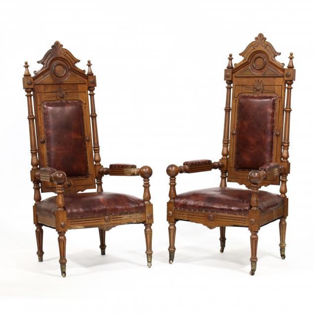 PAIR OF ANTIQUE WALNUT AND LEATHER