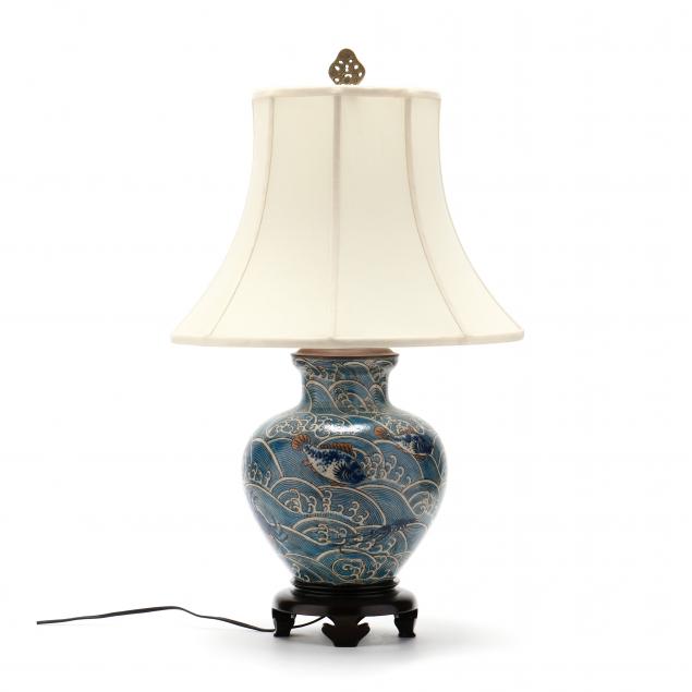 AN ASIAN STYLE VASE LAMP WITH WAVES
