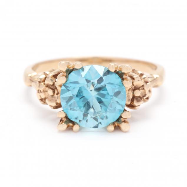 GOLD AND BLUE ZIRCON RING Centering