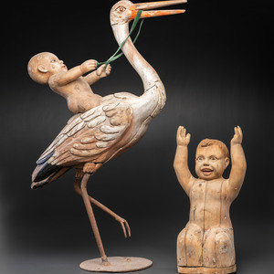 A Folk Art Carved and Painted Wood