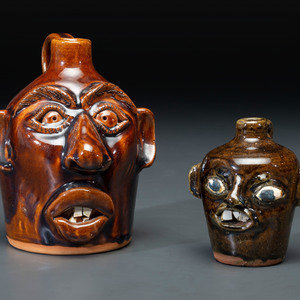 Two Southern Stoneware Face Jugs 20th 345a29