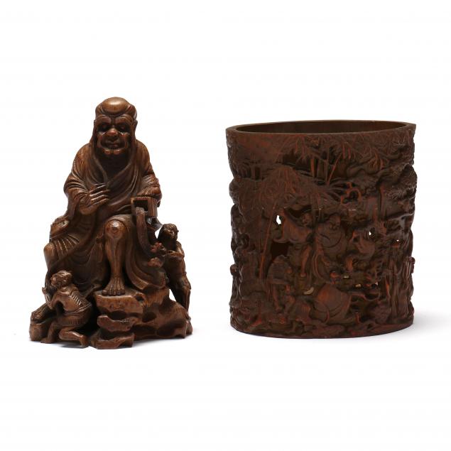 A CHINESE CARVED WOODEN SEATED ARHAT