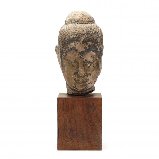 A CARVED STONE THAI BUDDHA HEAD