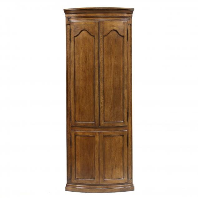 ENGLISH STYLE BOW-FRONT OAK CORNER CUPBOARD