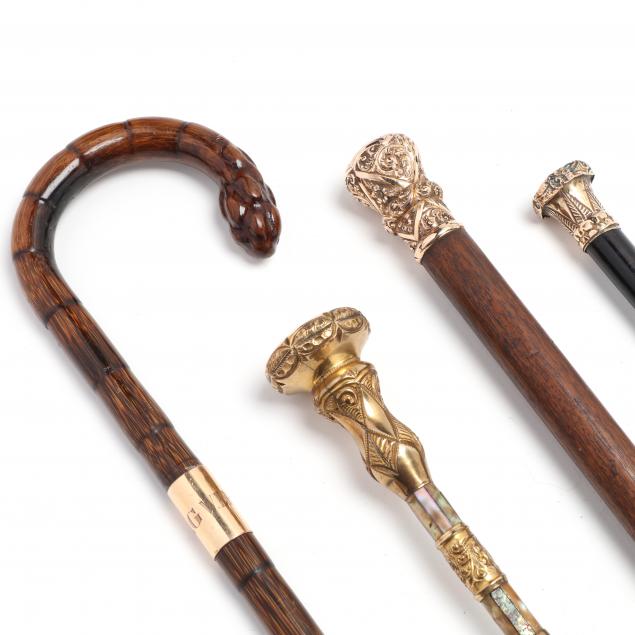 FOUR GOLD FILLED HANDLED CANES 348d47