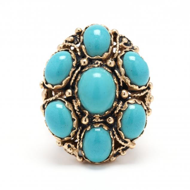 GOLD AND TURQUOISE RING Of oval 3492cc