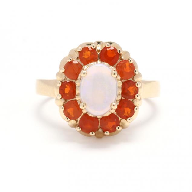 GOLD AND OPAL RING Centered on