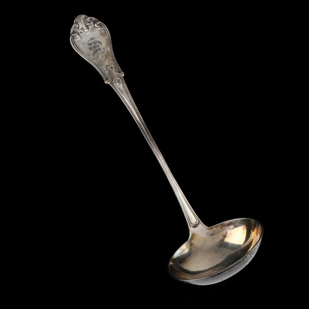 AN AMERICAN COIN SILVER SOUP LADLE