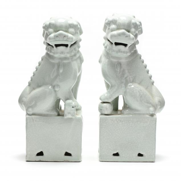 A PAIR OF ASIAN FOO LION SCULPTURES