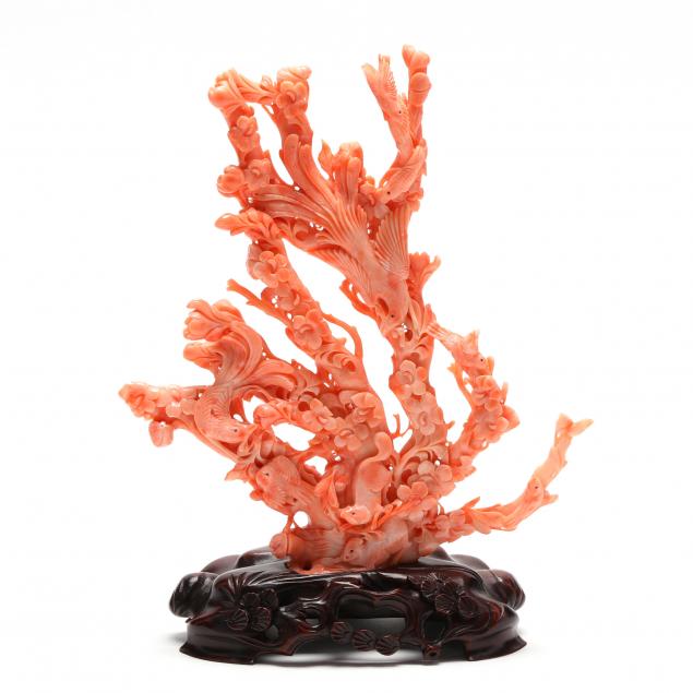A CORAL CARVING OF BIRDS, FLOWERS,