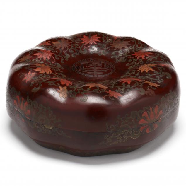 A CHINESE LACQUER PUMPKIN SHAPED