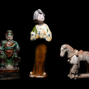 Three Chinese Pottery Figures
comprising