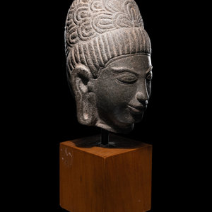 A Khmer Stone Head of Deity bearing 349c27