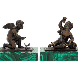 A Pair of Bronze Figures of Kneeling