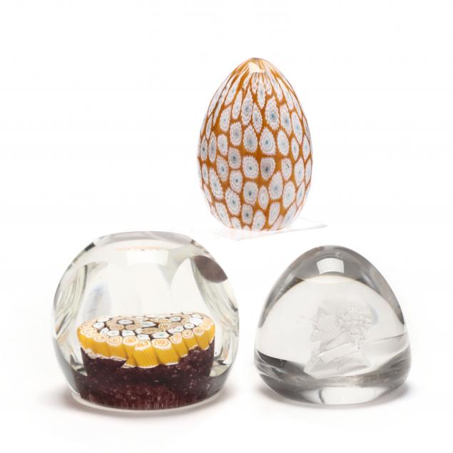 A GROUPING OF THREE GLASS PAPERWEIGHTS