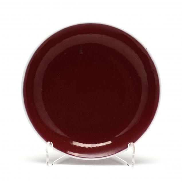 A CHINESE PORCELAIN OXBLOOD DISH  Late