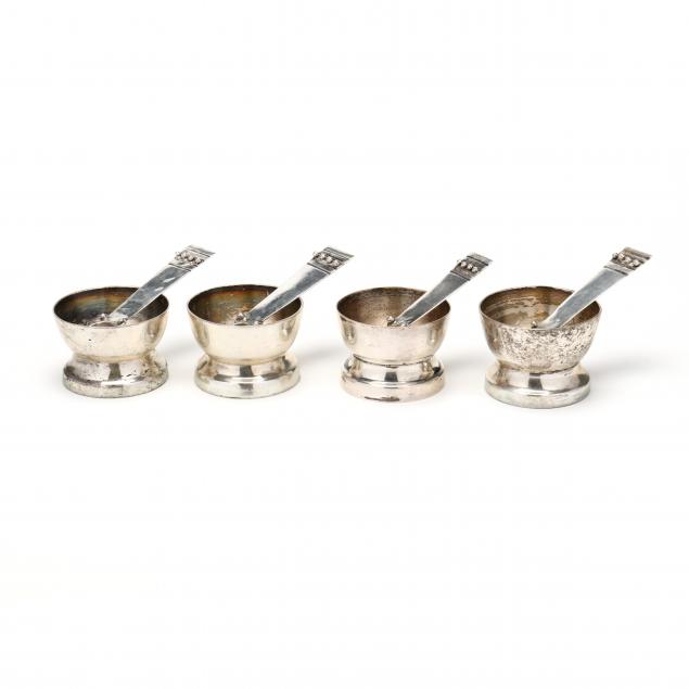 FOUR STERLING SILVER SALT CELLARS AND