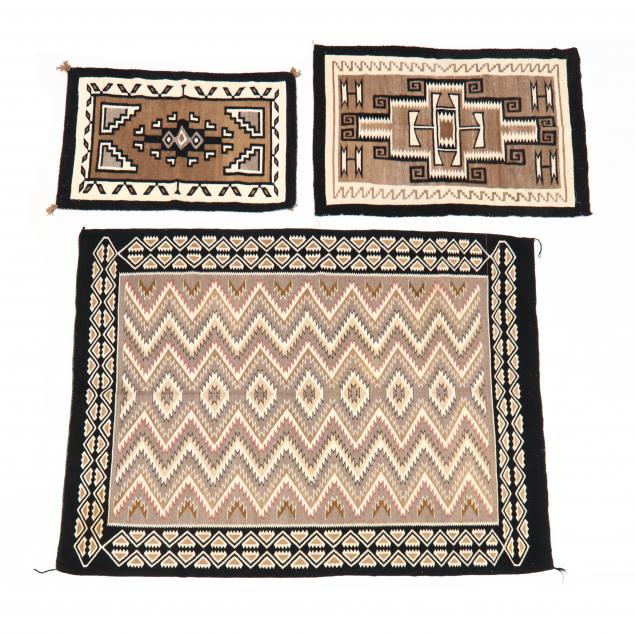 THREE NAVAJO AREA RUGS First with
