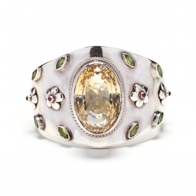 A WIDE SILVER AND GEM-SET BANGLE