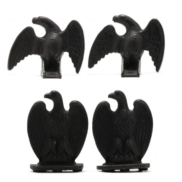 TWO PAIR OF CAST IRON EAGLE MOUNTS