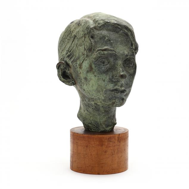 CAST METAL HEAD OF A BOY SIGNED 34884a