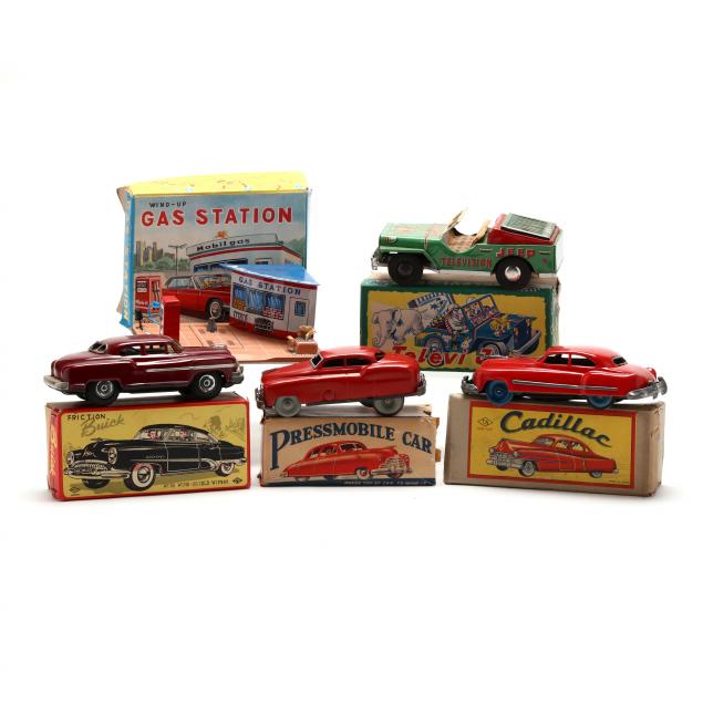 A SELECTION OF FIVE TIN TOYS, ALL