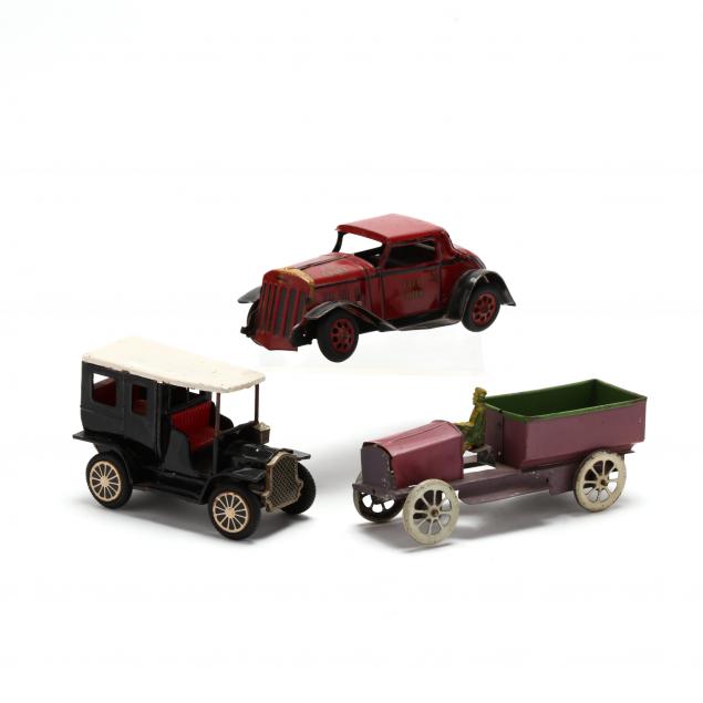 THREE VINTAGE TOY VEHICLES The first