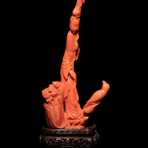 A Chinese Carved Red Coral Figure