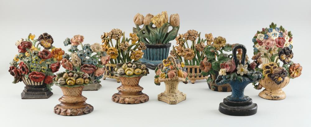 THIRTEEN CAST IRON FLOWER DOORSTOPS