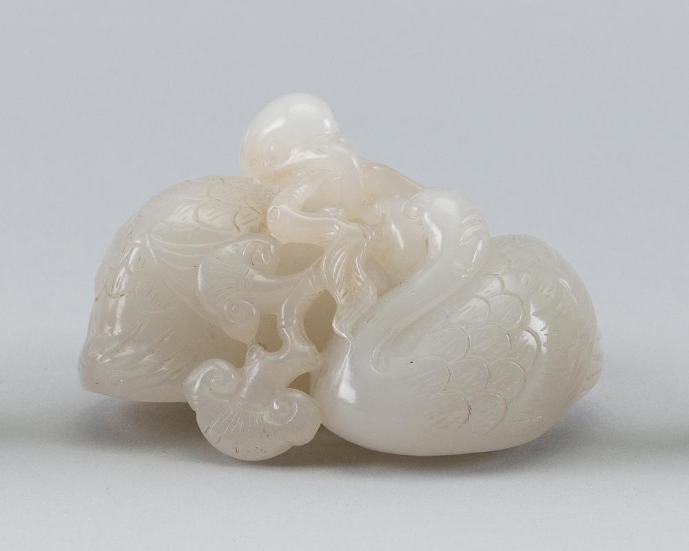 CHINESE CARVED WHITE JADE FIGURE