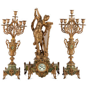 A French Metal and Onyx Clock Garniture 34c936