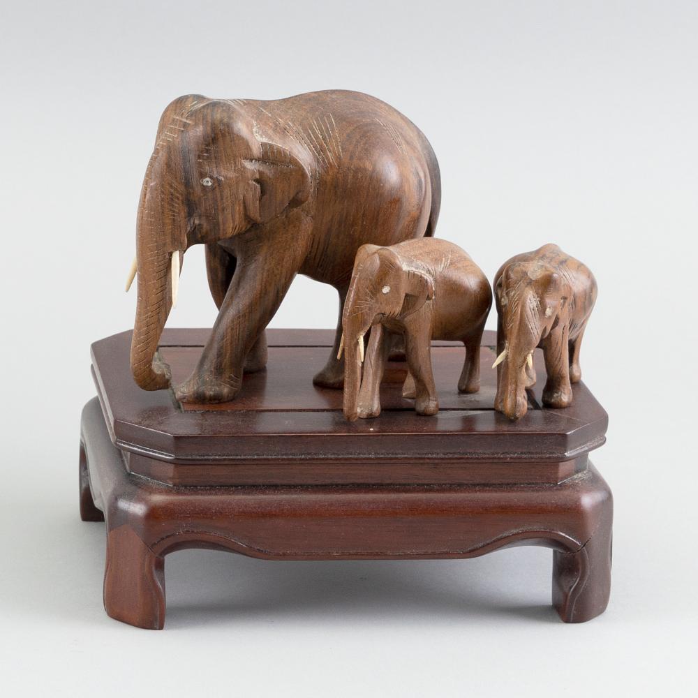 THREE CHINESE CARVED WOODEN ELEPHANTS