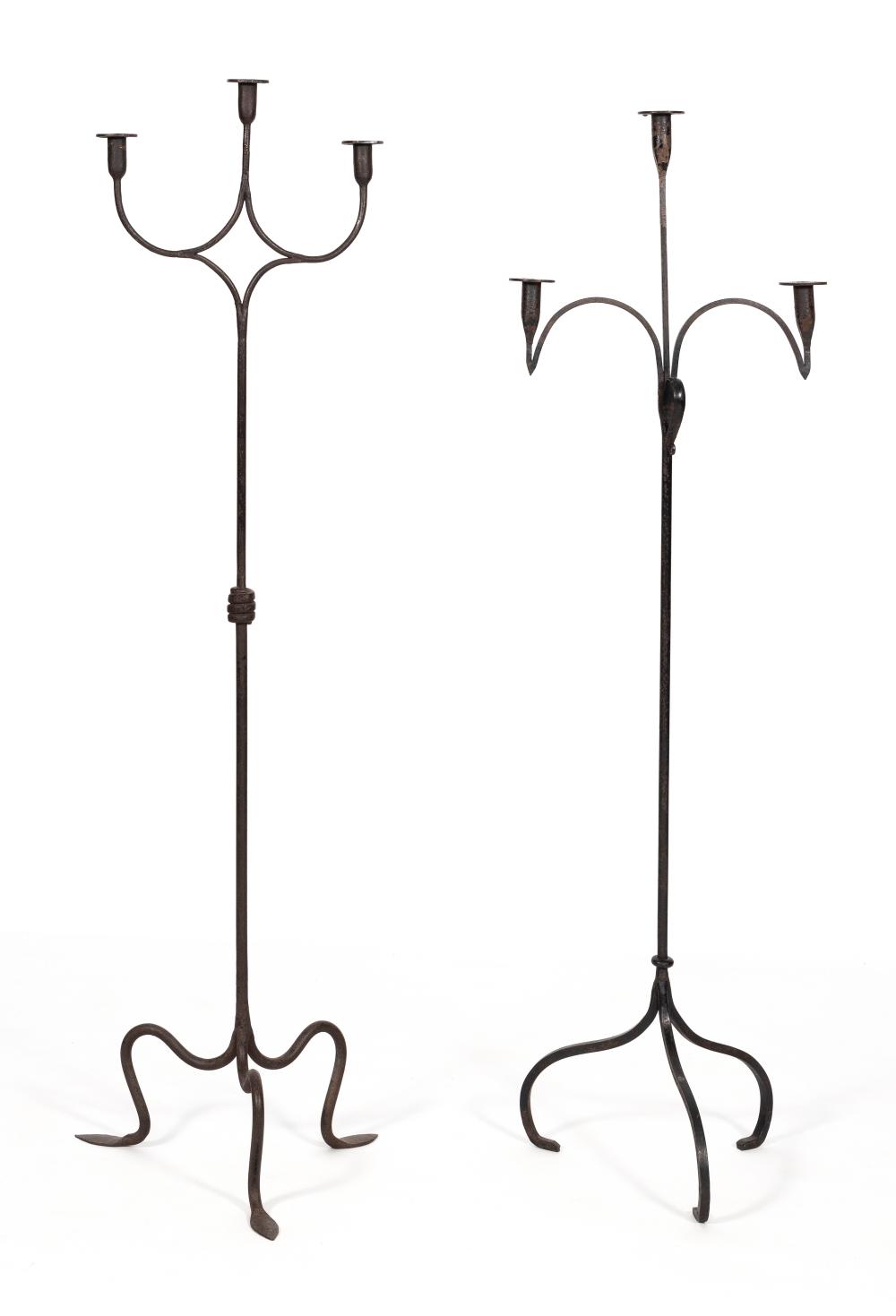 TWO WROUGHT IRON FLOOR CANDLEHOLDERS