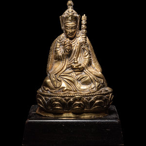 A Tibetan Gilt Bronze Figure of