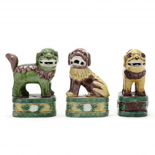 THREE CHINESE PORCELAIN FOO DOGS ON