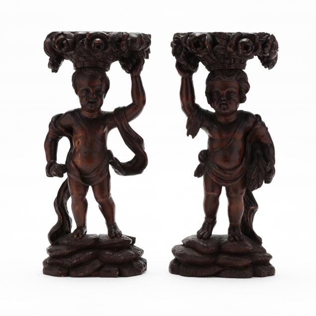 A PAIR OF CARVED WOOD STANDS IN 34abff