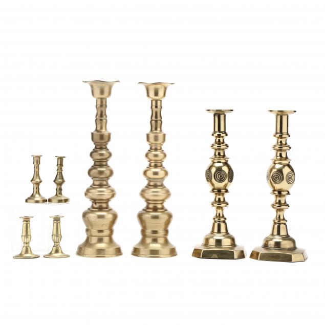 TWO PAIRS OF TALL BRASS CANDLESTICKS