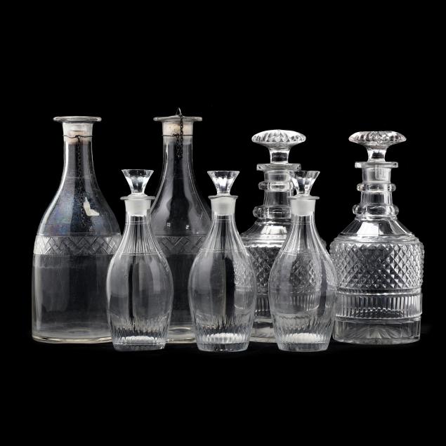 GROUPING OF SEVEN CUT GLASS DECANTERS 34adcb