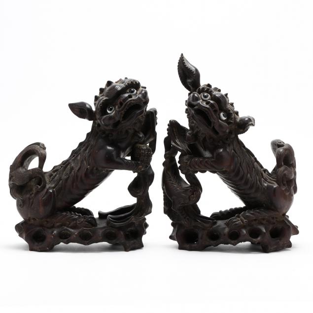 A PAIR OF CHINESE CARVED FOO LIONS Early