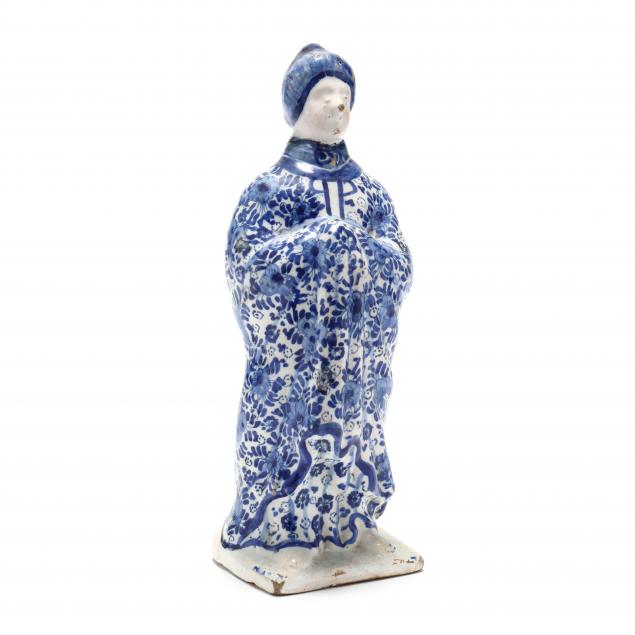 A BLUE AND WHITE DELFT FIGURE OF 34aff5