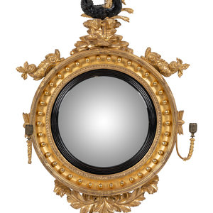 A Regency Parcel Ebonized Giltwood 34b058