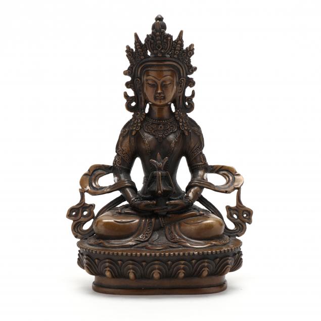 A TIBETAN GILT BRONZE GODDESS FIGURE