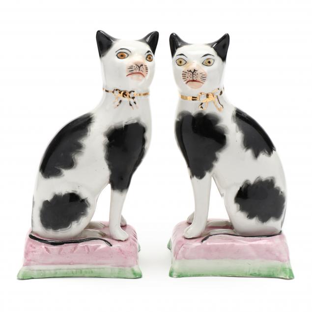 A PAIR OF STAFFORDSHIRE BLACK AND WHITE