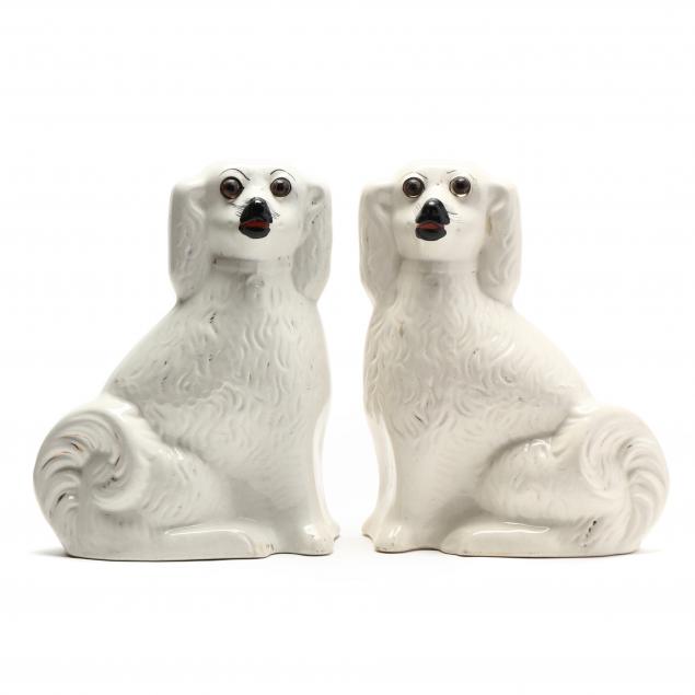 A PAIR OF FACING STAFFORDSHIRE SPANIELS