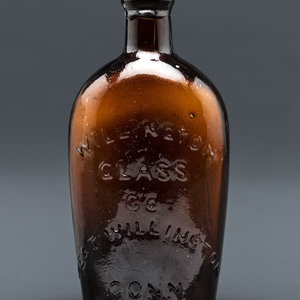 A Molded-Glass Flask in Amber by Willington