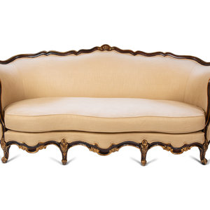 A Louis XV Style Parcel Gilt Walnut